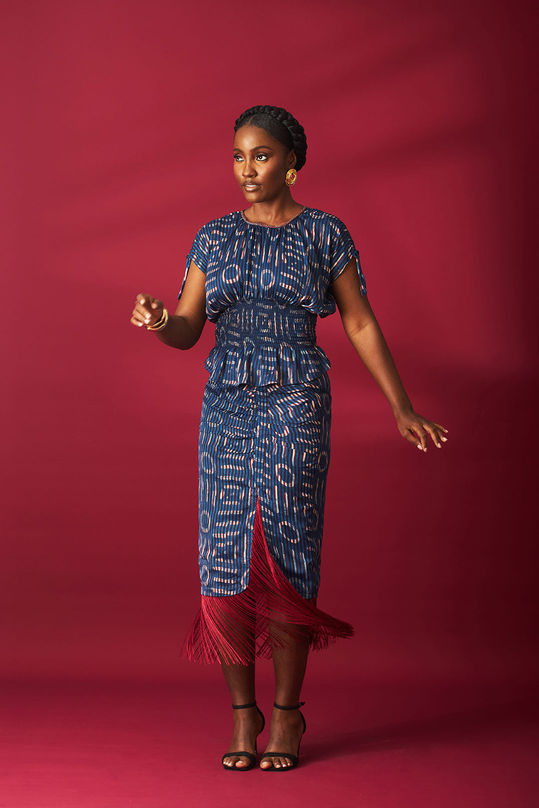 Kwelaku Candy smocked peplum blouse